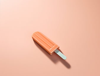 Minimalist Orange Popsicle on Pastel Background