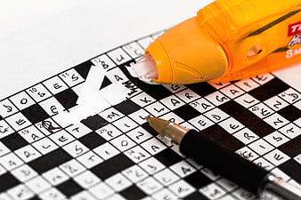 Correction tape fixing mistake on crossword puzzle