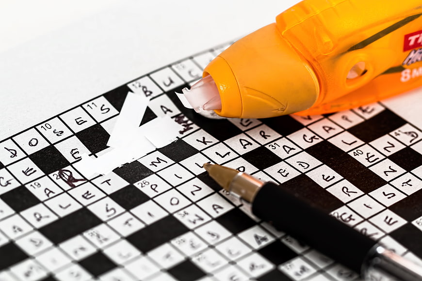 Correction tape fixing mistake on crossword puzzle