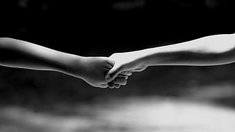Black and White Close Up of Two Children Holding Hands