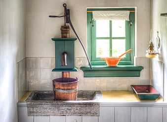Vintage Dutch Kitchen with Hand Pump and Green Window