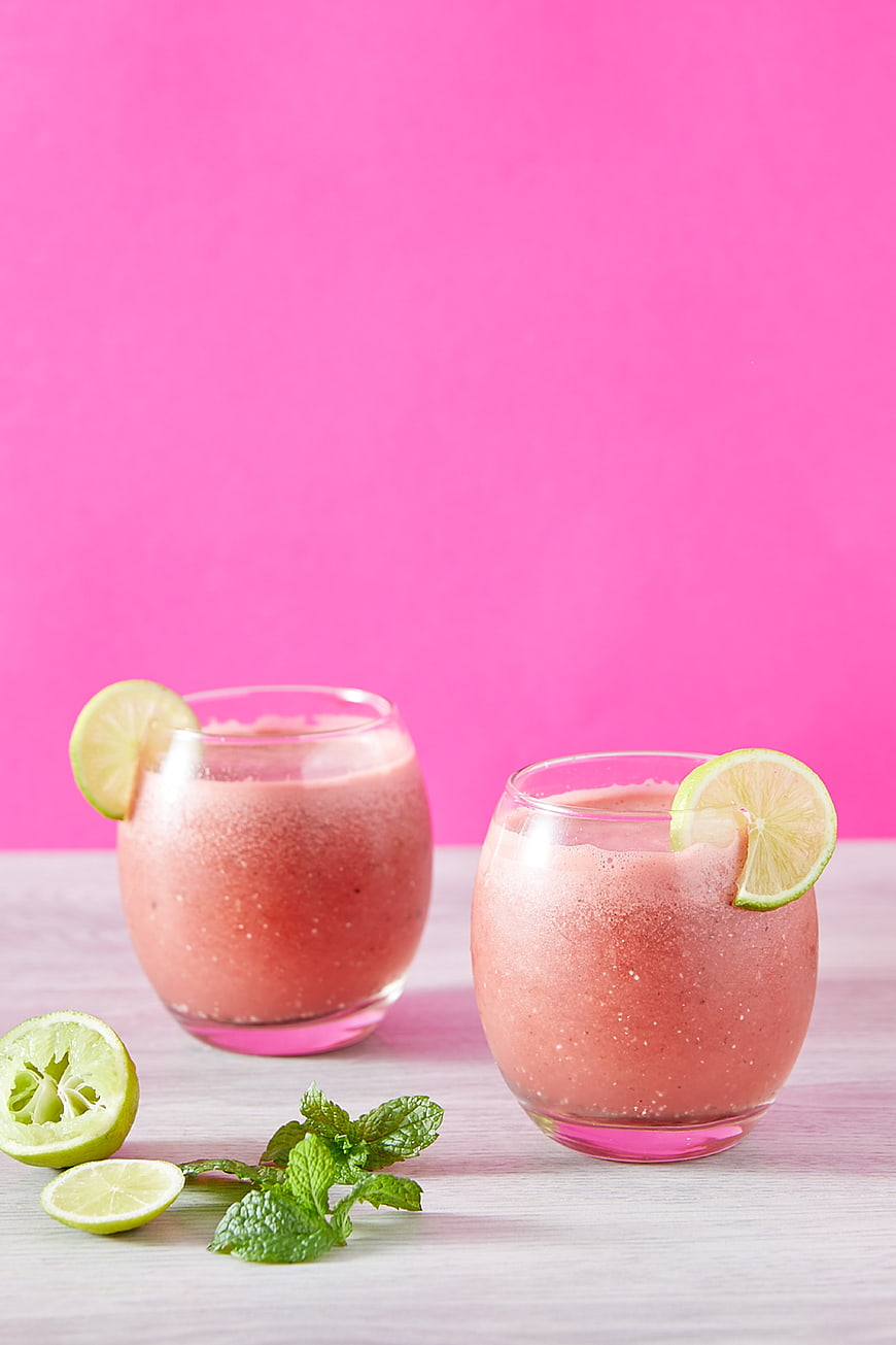 Refreshing Watermelon Smoothie with Lime and Mint on Pink Background