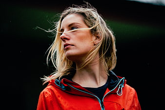 Blonde Woman in Red Jacket with Windblown Hair