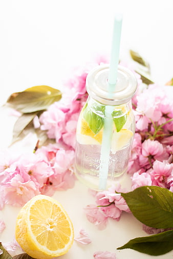 Refreshing Lemonade in Glass Jar with Pink Cherry Blossoms