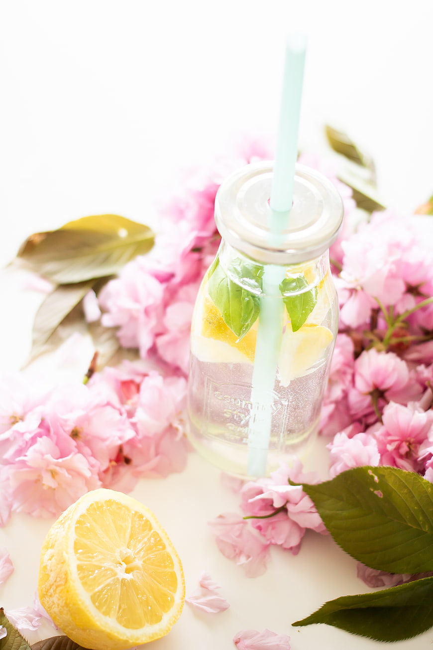 Refreshing Lemonade in Glass Jar with Pink Cherry Blossoms