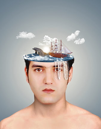 Conceptual surreal portrait of man with ocean in head
