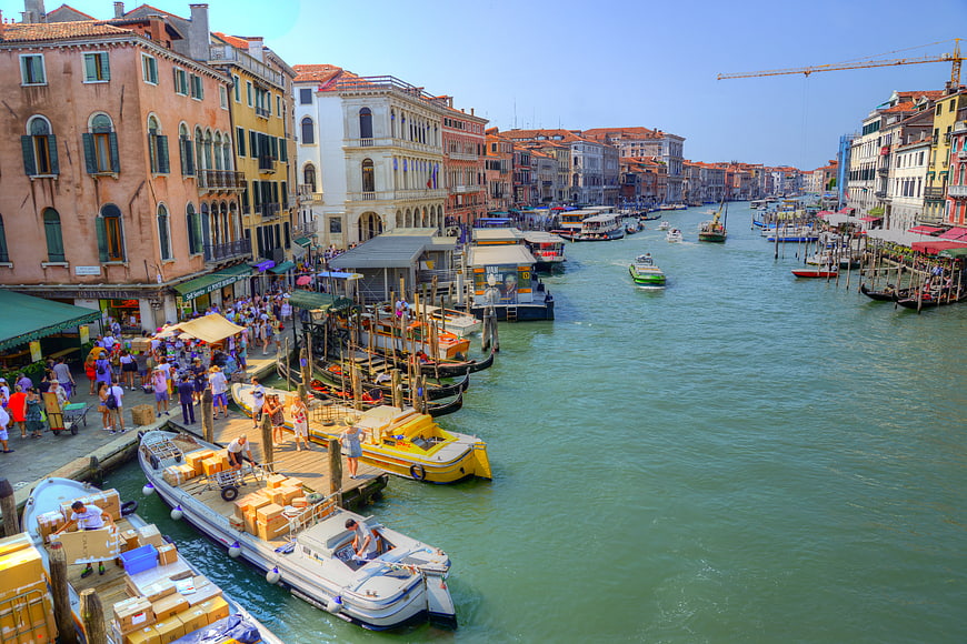 Busy Venice Canal with Boats and Crowds