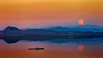 Silhouette of Canoeist on Lake at Sunset with Moon