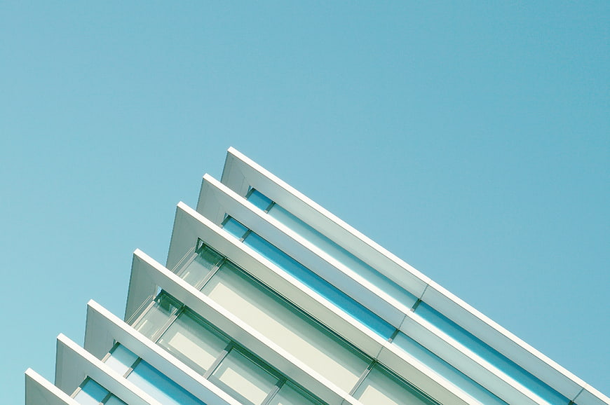 Modern white building facade against blue sky