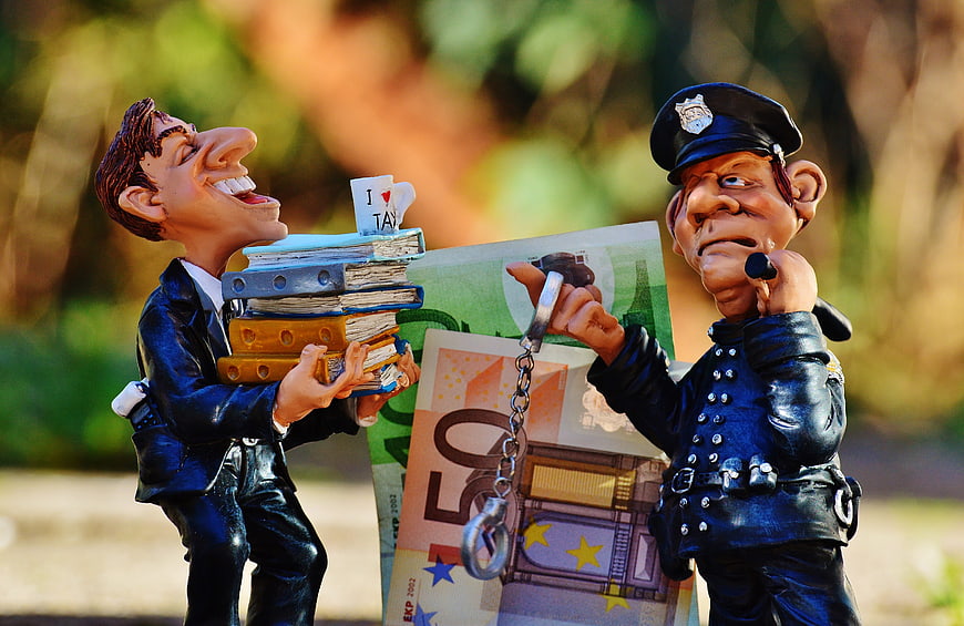Tax Evasion Concept with Bobblehead Figures and Euro Banknotes