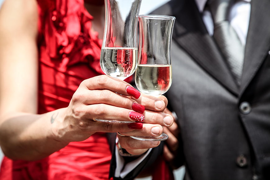 Couple Toasting with Champagne Glasses at Wedding