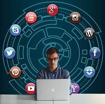 Man working on laptop surrounded by social media icons and digital network