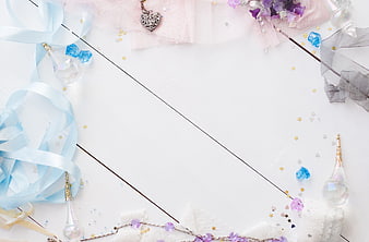 Pastel Flat Lay Background With Ribbons, Crystals, and Jewelry