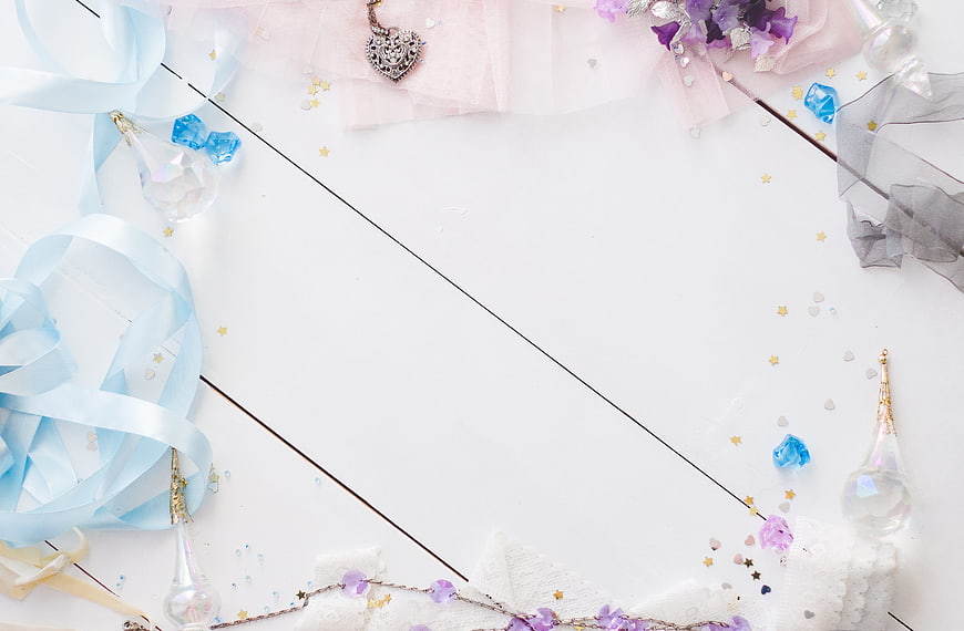 Pastel Flat Lay Background With Ribbons, Crystals, and Jewelry
