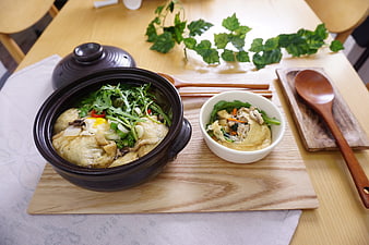 Korean Fish Cake Soup with Greens and Egg in Ceramic Pot