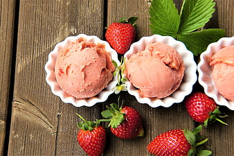 Strawberry Ice Cream Scoops on Rustic Wooden Table