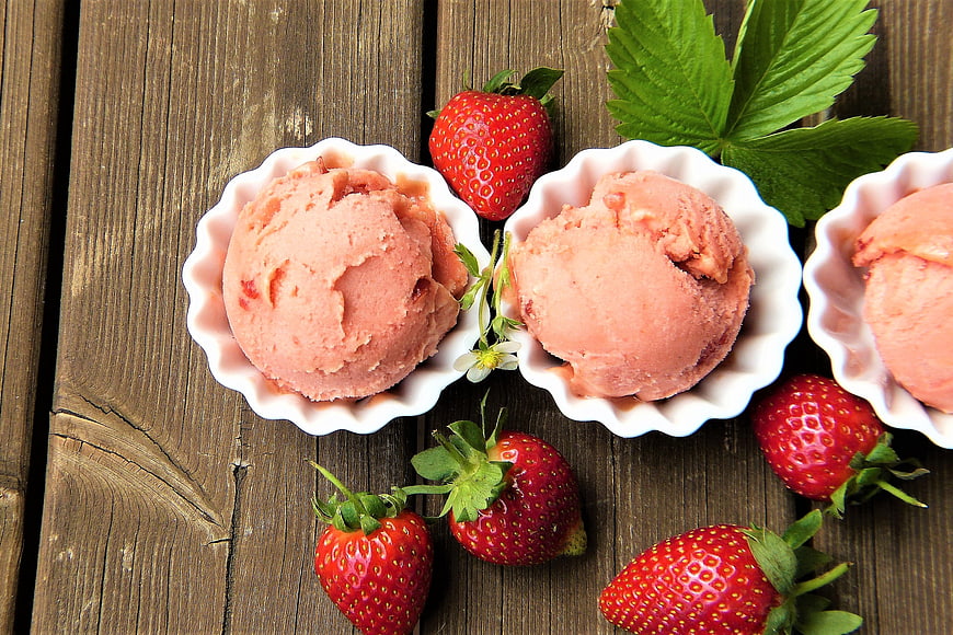 Strawberry Ice Cream Scoops on Rustic Wooden Table