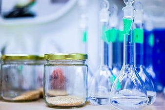 Laboratory glass jars and flasks with chemical samples