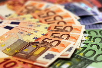 Close-up of stacked 50, 100, and 20 Euro banknotes