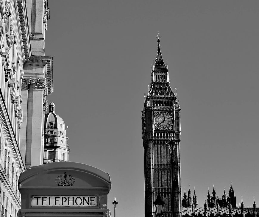 Black and white photo of Big Ben and red telephone box in London