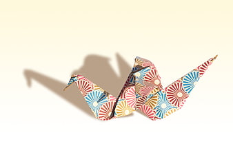 Colorful Patterned Origami Crane on White Background