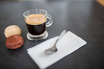 Espresso Coffee and Macarons on Dark Table
