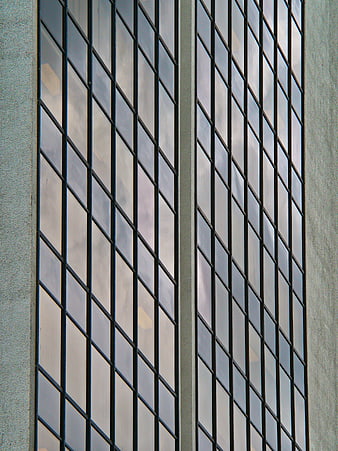 Abstract geometric pattern of modern office building glass facade