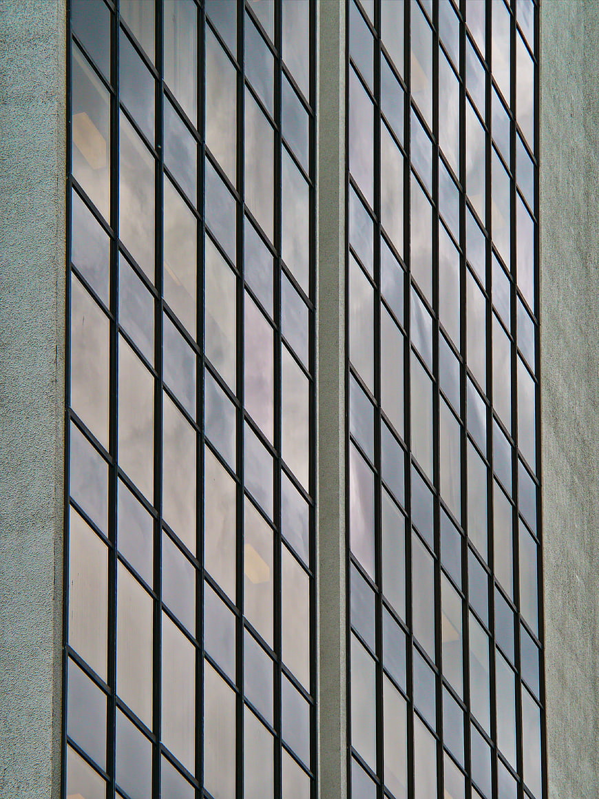 Abstract geometric pattern of modern office building glass facade