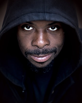 Intense Portrait of Man in Black Hoodie