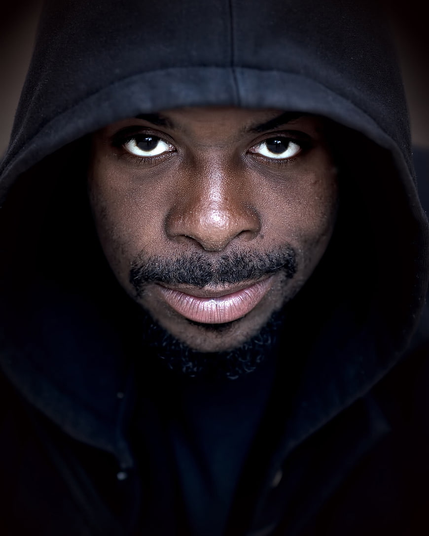 Intense Portrait of Man in Black Hoodie