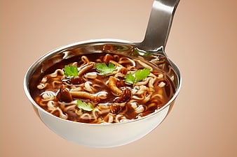 Metal Ladle with Dark Noodle Soup and Parsley Garnish