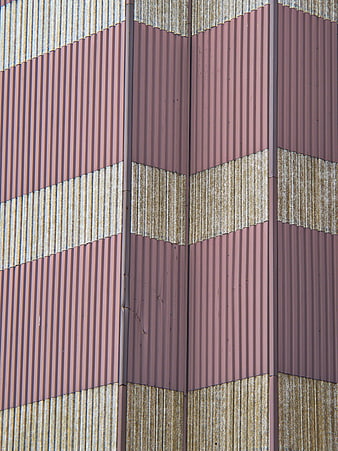 Abstract Corrugated Metal Wall with Pink and Rust Stripes