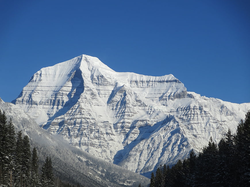 Majestic Snow-Capped Mountain Peak Against Blue Sky