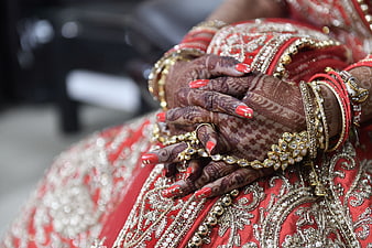 Close-up of Indian Bride Hands with Henna and Jewelry