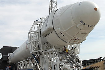 SpaceX Falcon 9 rocket on transporter erector at launch site