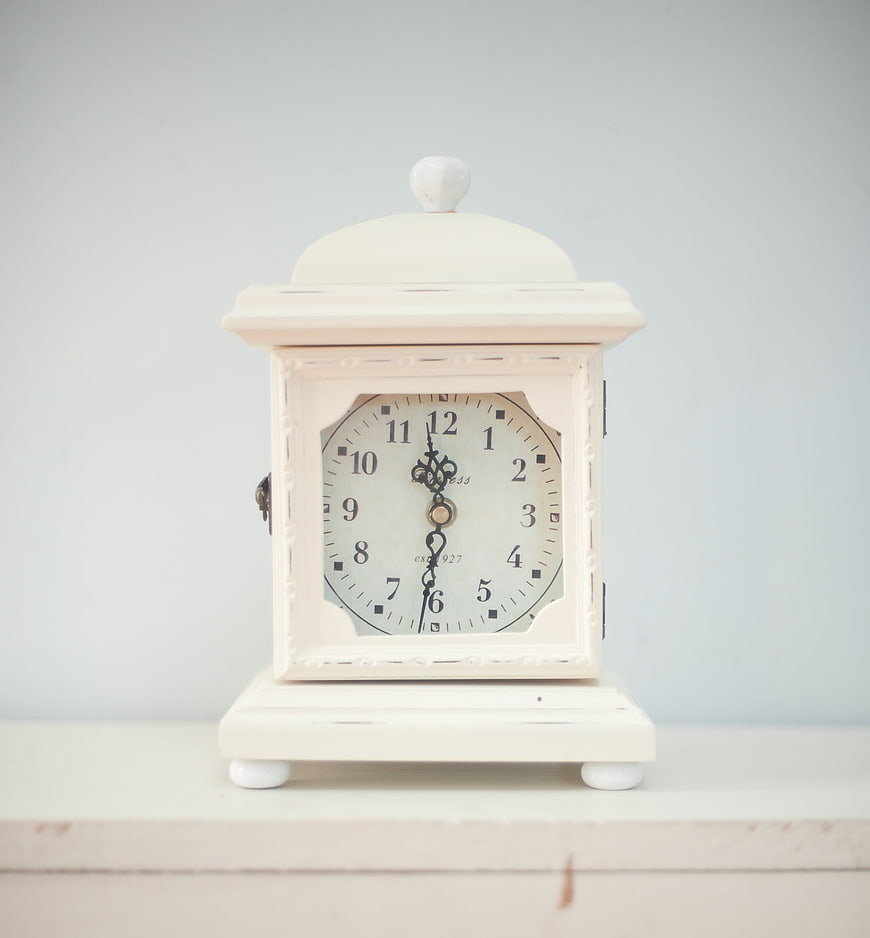 Vintage Cream Mantel Clock On White Shelf