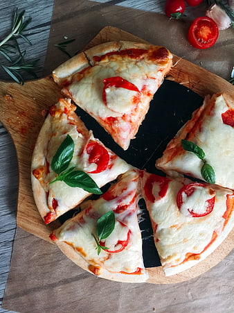 Top view of homemade margherita pizza with fresh basil