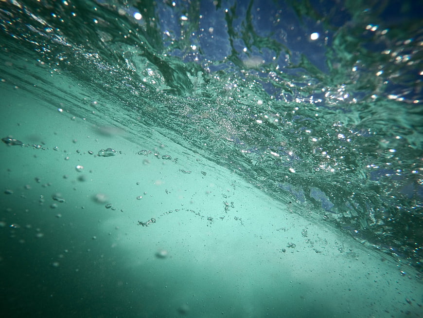 Underwater View of Turbulent Water Surface with Bubbles