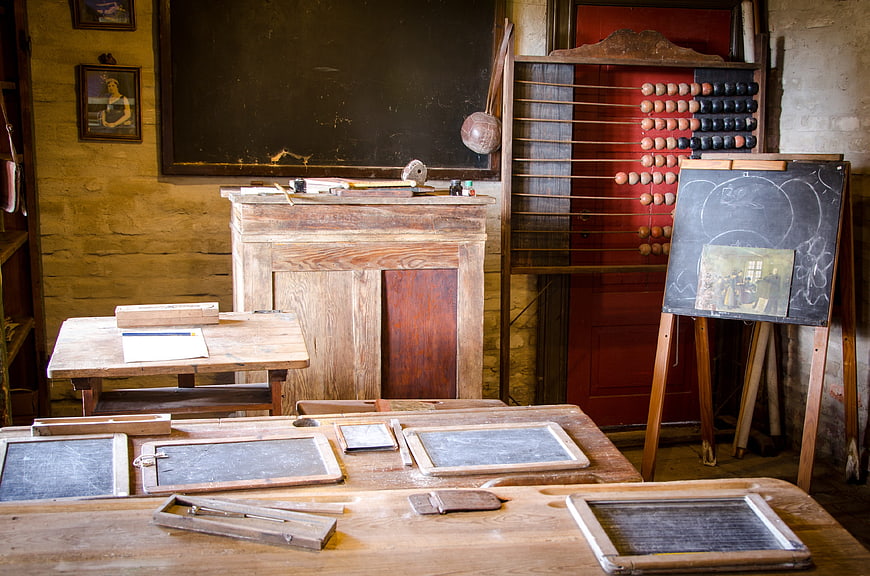 Vintage Classroom Interior with Antique Wooden Desks and Abacus