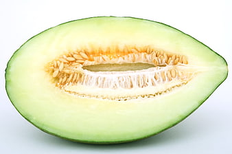 Sliced Honeydew Melon Half With Seeds On White Background