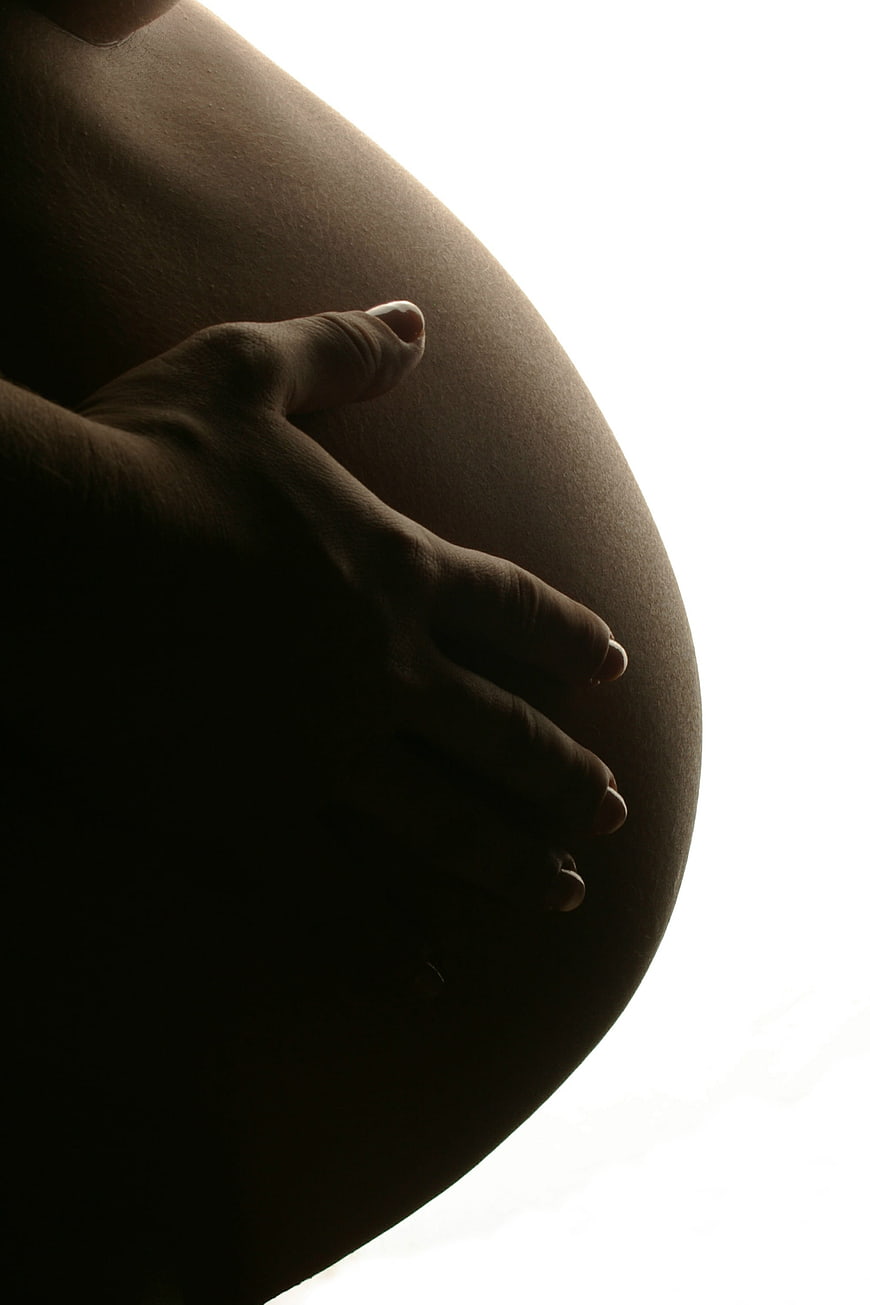 Pregnant Woman Holding Belly Silhouette Close Up