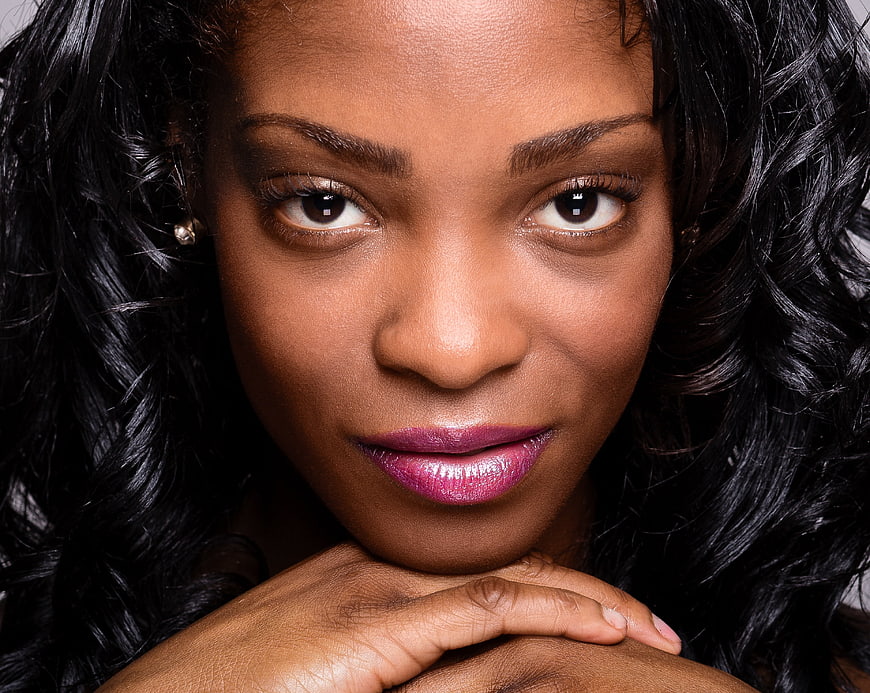 Close-up portrait of beautiful black woman with curly hair