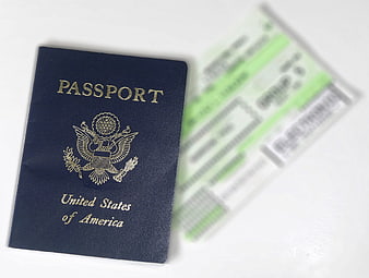 US Passport and Blurred Boarding Pass on White Background