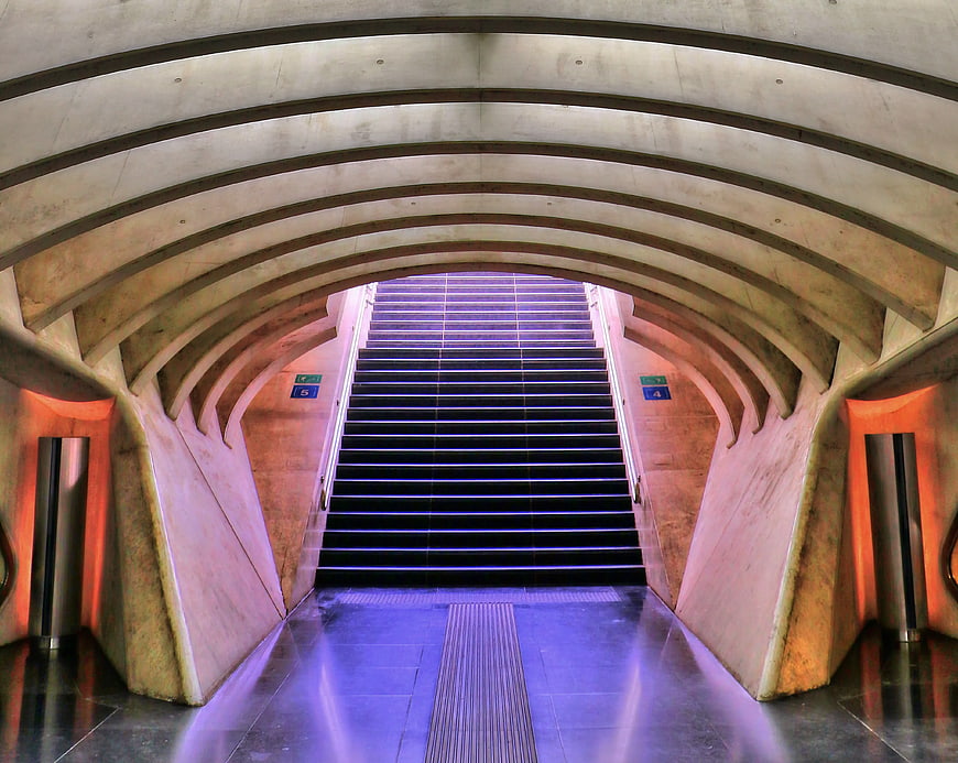 Modern concrete staircase with purple and orange lighting