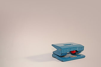 Vintage Blue Hole Punch on White Background