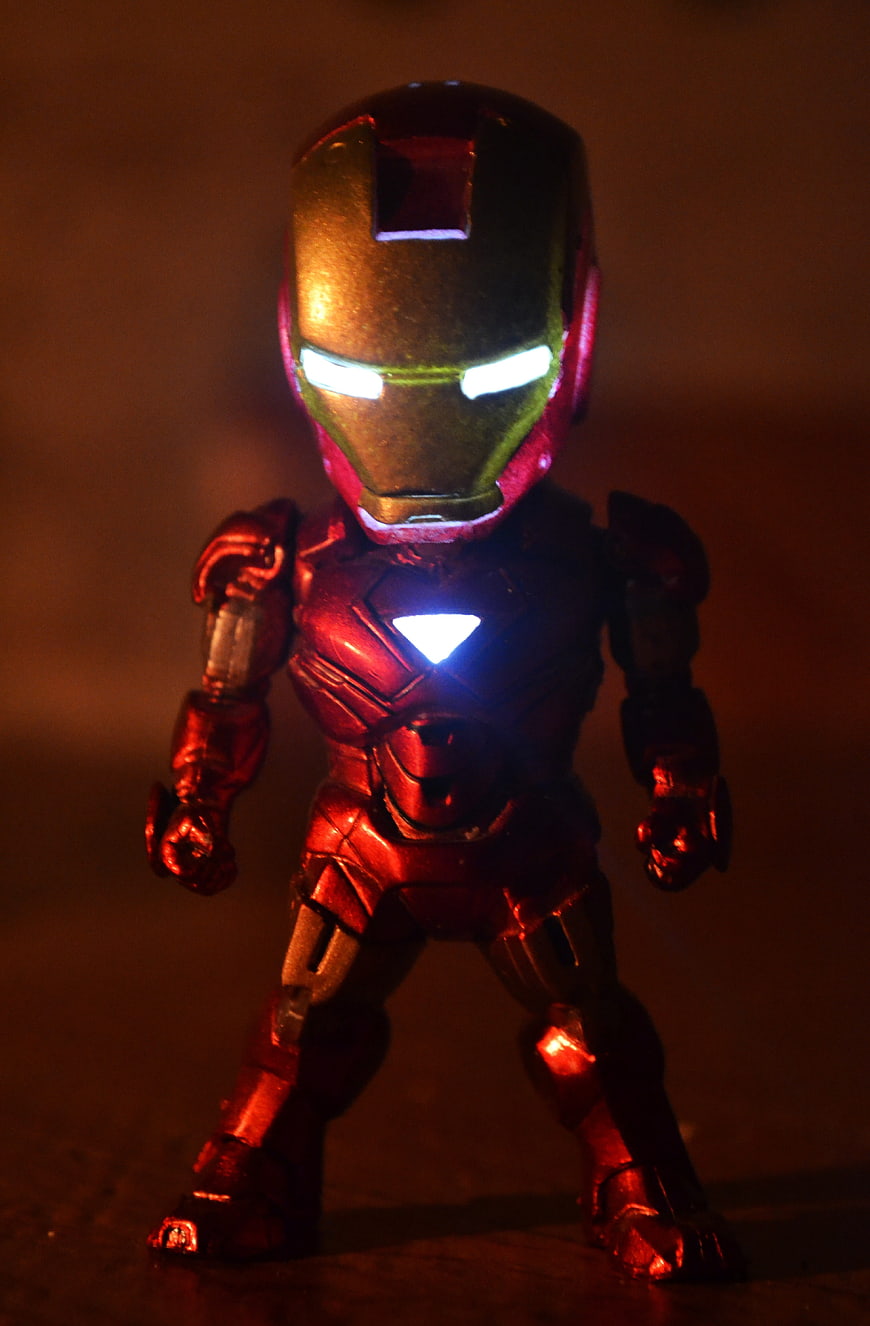 Glowing Iron Man Action Figure in Dark Cinematic Lighting