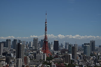 Tokyo Tower Rising Above Cityscape Under Blue Sky