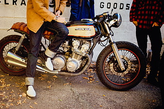 Custom Honda Motorcycle with Rider in Urban Street Setting