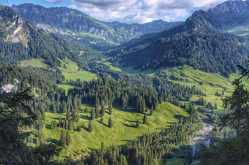 Panoramic Alpine Valley with Green Hills and River