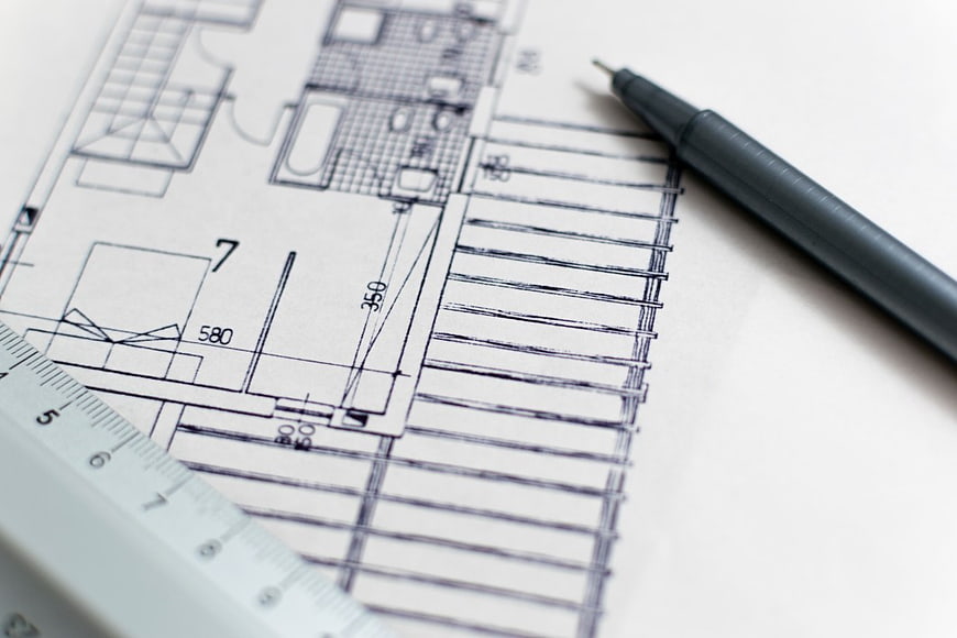 Architectural Blueprint with Pen and Ruler